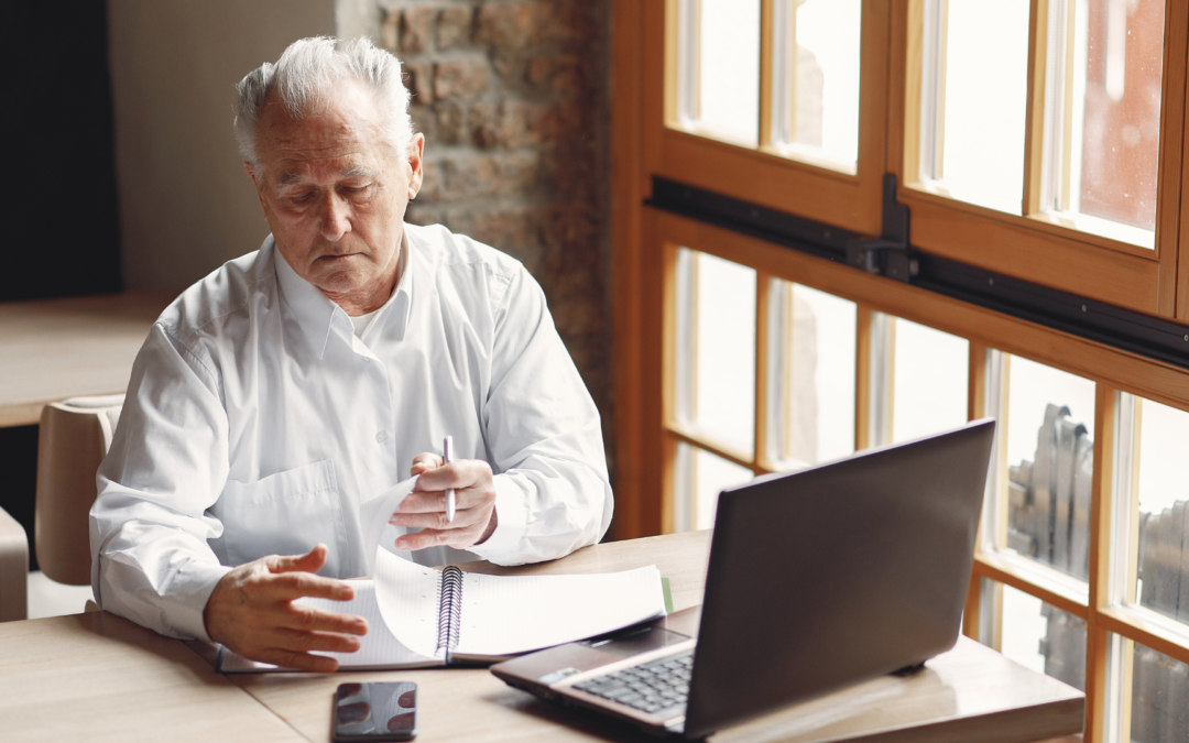 Business owner reviewing financial documents to understand the value of their business before selling.